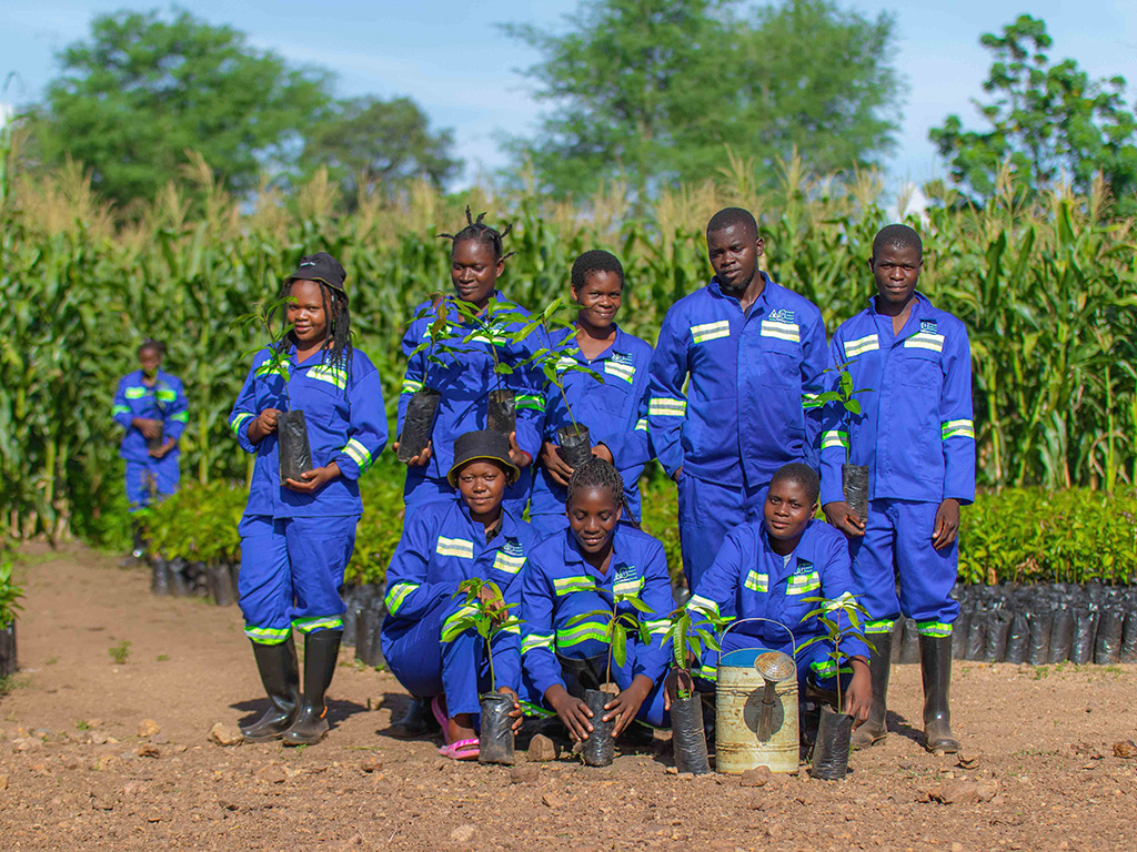students holding seedlings