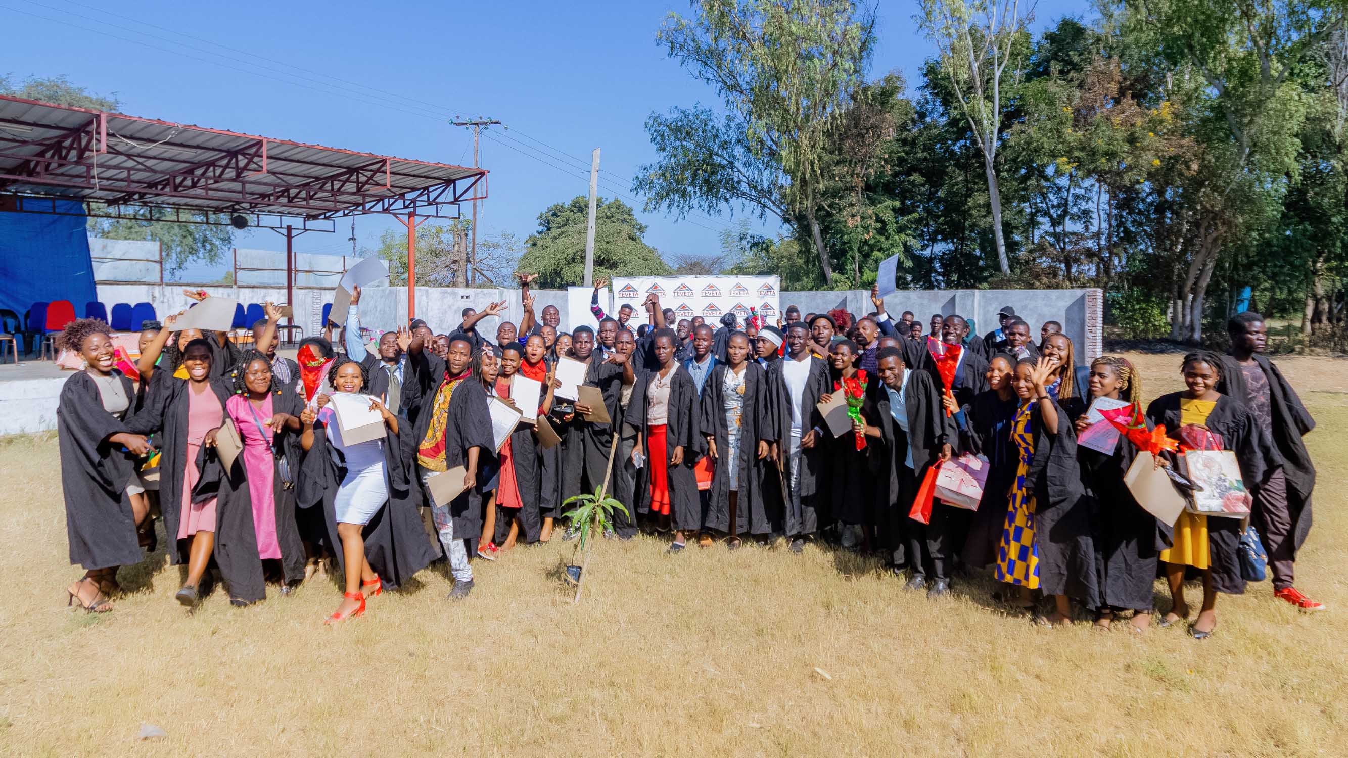 graduates posses for a pic